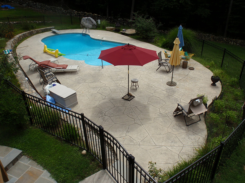 Swimming pool and stamped concrete project example 43